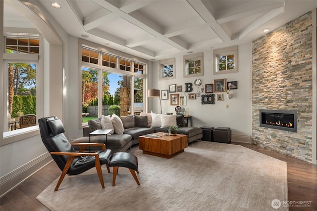 9420 NE 31st St, Clyde Hill, WA 98004 - living area featuring plenty of natural light, a towering ceiling, a stone fireplace, wood-type flooring, and coffered ceiling