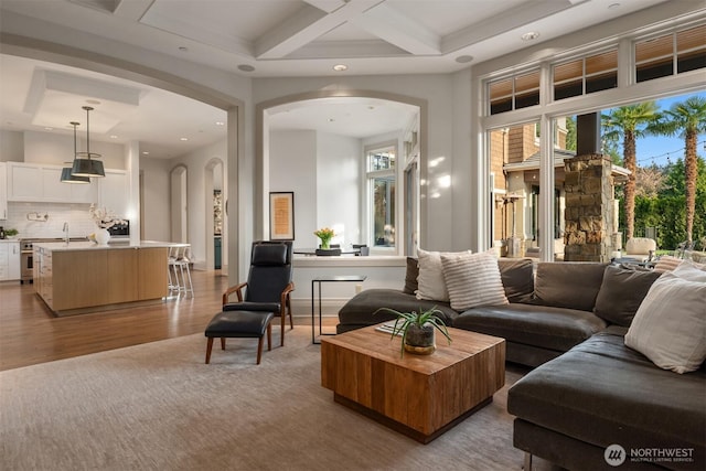 9420 NE 31st St, Clyde Hill, WA 98004 - living area with arched walkways, plenty of natural light, coffered ceiling, beam ceiling, and recessed lighting