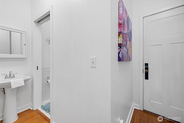 129 Warren Ave N Unit 18, Seattle, WA 98109 - bathroom with baseboards and wood finished floors