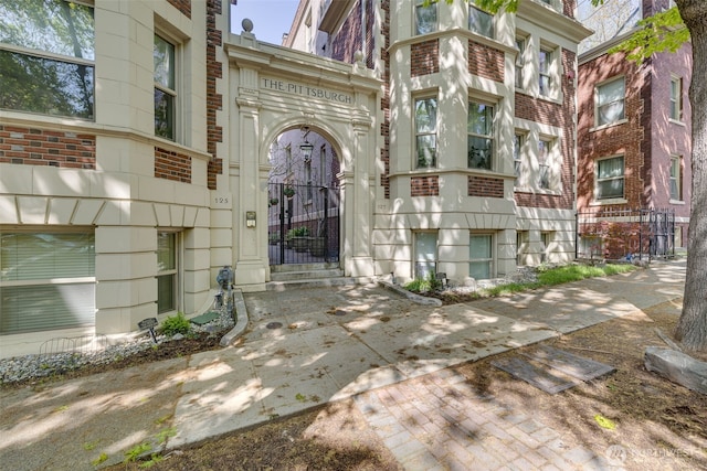 129 Warren Ave N Unit 18, Seattle, WA 98109 - view of exterior entry featuring brick siding and a gate