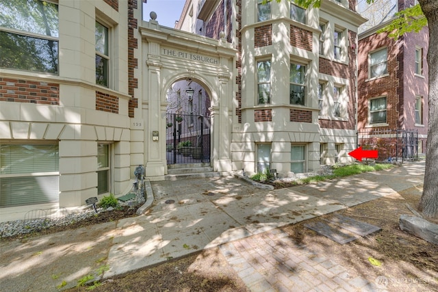 129 Warren Ave N Unit 18, Seattle, WA 98109 - doorway to property with brick siding and a gate