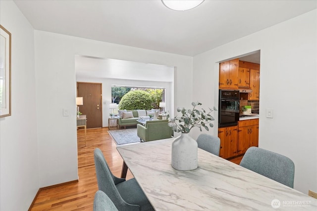 9125 221st St SW, Edmonds, WA 98026 - dining area featuring light wood finished floors and baseboards