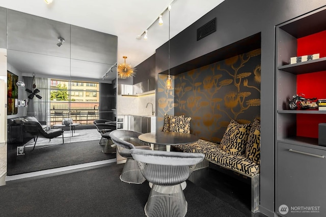 1425 Western Ave Unit L308, Seattle, WA 98101 - living area with track lighting and carpet floors