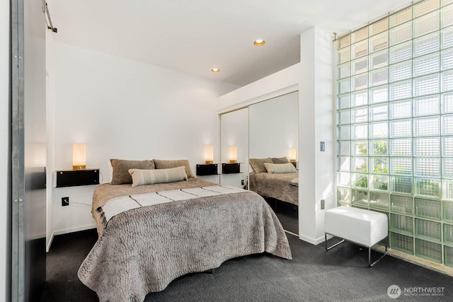 1425 Western Ave Unit L308, Seattle, WA 98101 - bedroom with dark colored carpet, recessed lighting, baseboards, and a closet