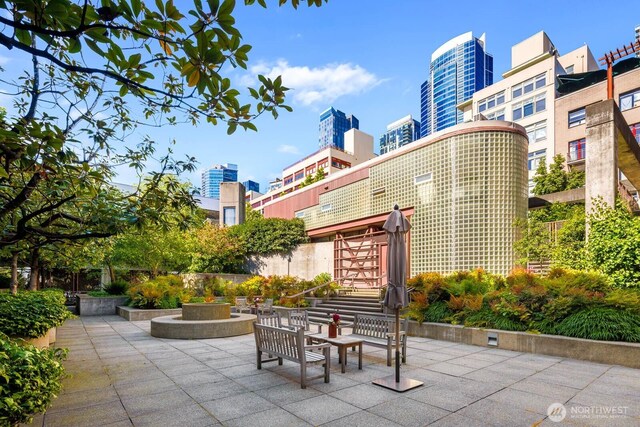1425 Western Ave Unit L308, Seattle, WA 98101 - view of patio with a city view and stairway