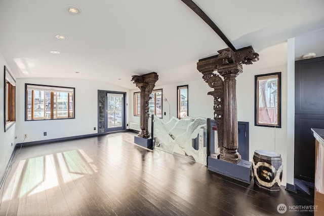 2040 Westlake Ave N Unit 26, Seattle, WA 98109 - living room featuring decorative columns, lofted ceiling, wood finished floors, plenty of natural light, and recessed lighting