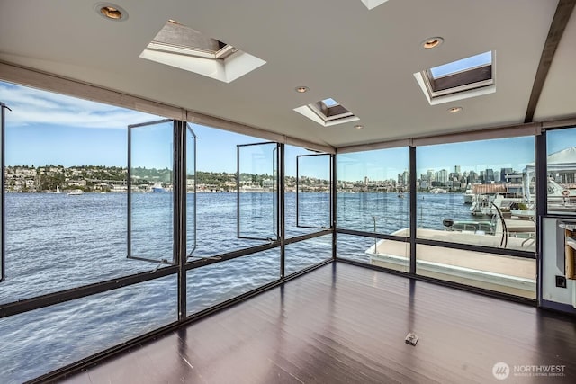 2040 Westlake Ave N Unit 26, Seattle, WA 98109 - interior space with a skylight, a water view, expansive windows, and wood finished floors