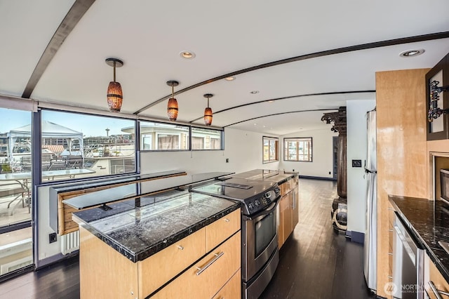 2040 Westlake Ave N Unit 26, Seattle, WA 98109 - kitchen featuring appliances with stainless steel finishes, tile counters, dark wood-type flooring, a center island, and light brown cabinets