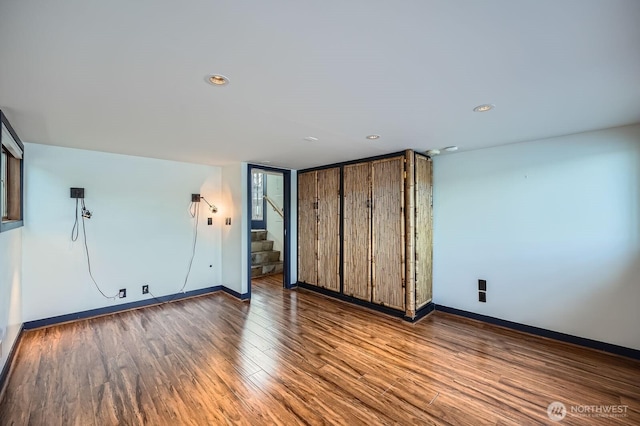 2040 Westlake Ave N Unit 26, Seattle, WA 98109 - unfurnished bedroom featuring wood finished floors and baseboards