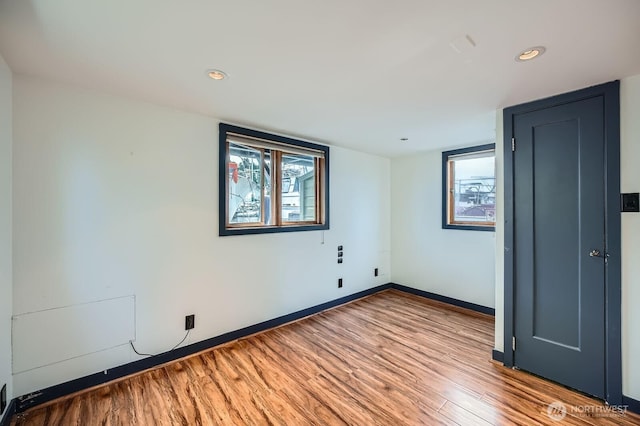 2040 Westlake Ave N Unit 26, Seattle, WA 98109 - empty room with wood finished floors and recessed lighting