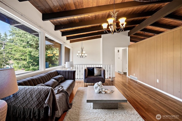 12508 SE 60th St, Bellevue, WA 98006 - living room featuring a chandelier, wooden ceiling, plenty of natural light, wooden walls, and wood finished floors