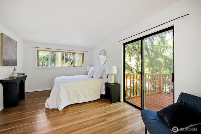 12508 SE 60th St, Bellevue, WA 98006 - bedroom featuring access to outside, wood finished floors, and baseboards