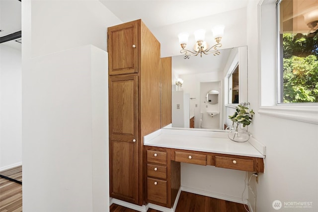 12508 SE 60th St, Bellevue, WA 98006 - bathroom with a chandelier, wood finished floors, and vanity