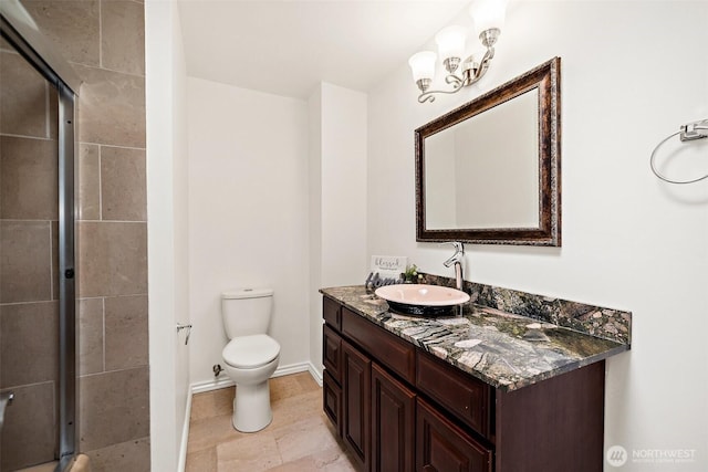 12508 SE 60th St, Bellevue, WA 98006 - bathroom with vanity, a stall shower, toilet, and baseboards