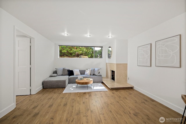 12508 SE 60th St, Bellevue, WA 98006 - living area with wood finished floors, baseboards, and a fireplace