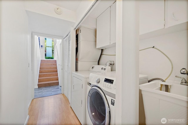 12508 SE 60th St, Bellevue, WA 98006 - laundry room featuring light wood-style flooring and separate washer and dryer