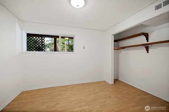 12508 SE 60th St, Bellevue, WA 98006 - unfurnished bedroom with light wood-style flooring, a closet, and baseboards