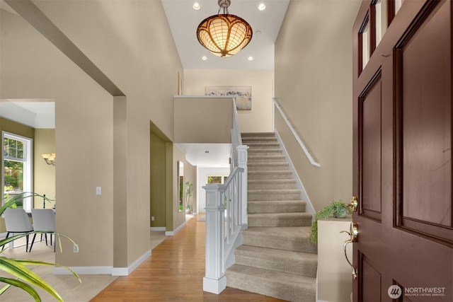 235 249th Pl NE, Sammamish, WA 98074 - entrance foyer with a chandelier, stairway, recessed lighting, wood finished floors, and baseboards