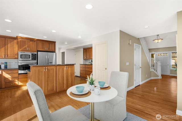 235 249th Pl NE, Sammamish, WA 98074 - dining space with light wood-style floors, recessed lighting, baseboards, and stairs