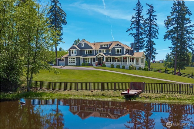 16006 288th St E, Graham, WA 98338 - back of property with a water view, driveway, and a garage