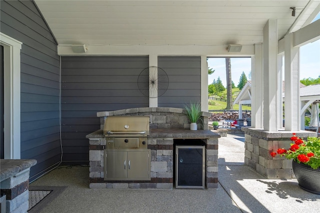 16006 288th St E, Graham, WA 98338 - view of patio / terrace with beverage cooler and an outdoor kitchen