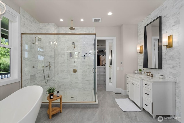 16006 288th St E, Graham, WA 98338 - bathroom featuring a shower stall, vanity, a freestanding tub, a spacious closet, and recessed lighting