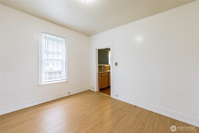 3827 S Morgan St, Seattle, WA 98118 - spare room featuring light wood finished floors and baseboards