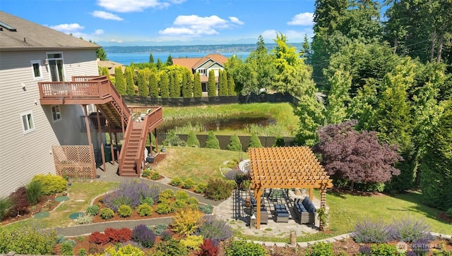 11572 NE Skyward Loop, Kingston, WA 98346 - view of green lawn with stairs and a deck with water view