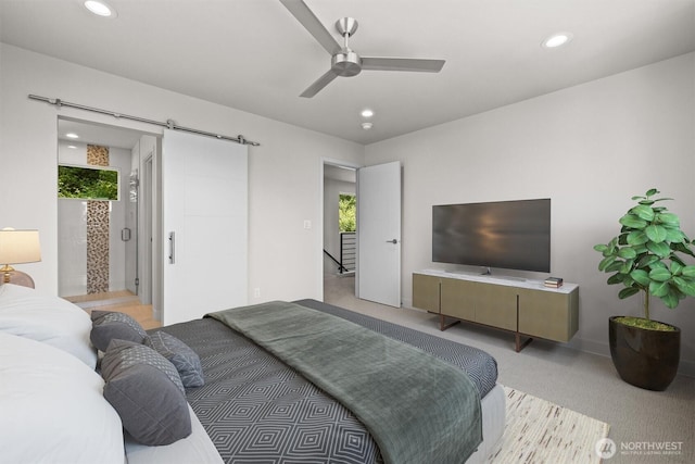 4570 22nd Ave SW, Seattle, WA 98106 - bedroom with multiple windows, recessed lighting, light carpet, a barn door, and ceiling fan