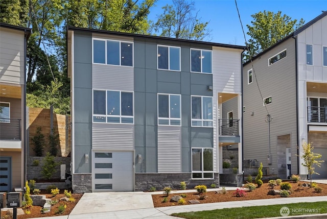 4570 22nd Ave SW, Seattle, WA 98106 - view of front of house with an attached garage and concrete driveway
