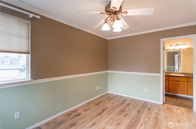 5614 Vincent Ct SE, Lacey, WA 98513 - empty room featuring a ceiling fan, crown molding, and light wood finished floors