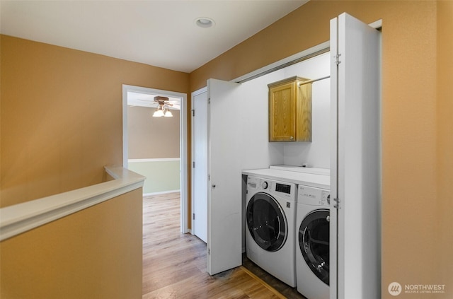 5614 Vincent Ct SE, Lacey, WA 98513 - washroom with washer and dryer, cabinet space, light wood-type flooring, and ceiling fan