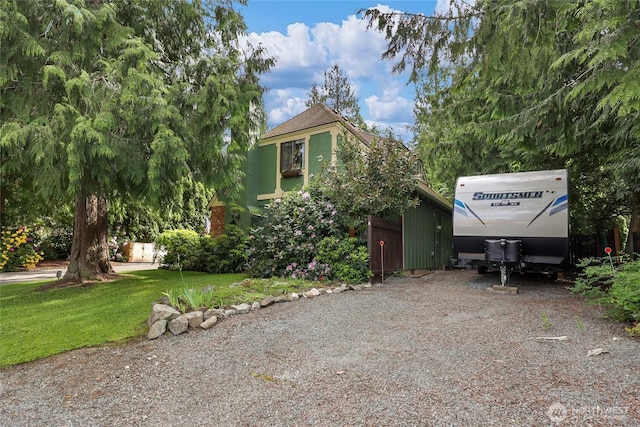 3904 Ridge Way, Mount Vernon, WA 98273 - view of property hidden behind natural elements with a front lawn, driveway, and stucco siding