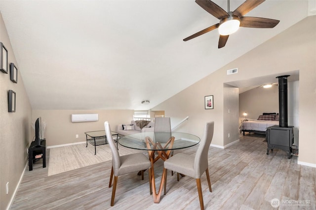4241 Rural Ave, Bellingham, WA 98226 - dining space with vaulted ceiling, light wood-style flooring, a ceiling fan, and baseboards