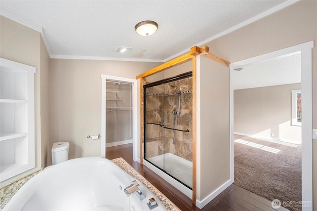 4241 Rural Ave, Bellingham, WA 98226 - bathroom featuring a freestanding tub, a stall shower, crown molding, a walk in closet, and wood finished floors