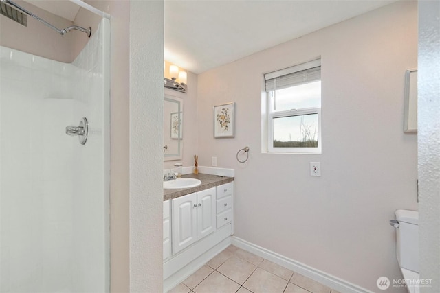 4241 Rural Ave, Bellingham, WA 98226 - bathroom featuring toilet, vanity, a shower, tile patterned floors, and baseboards