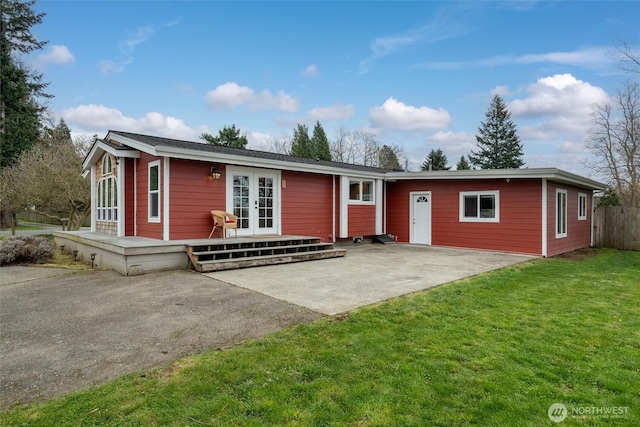 4241 Rural Ave, Bellingham, WA 98226 - ranch-style house featuring driveway, french doors, and a patio