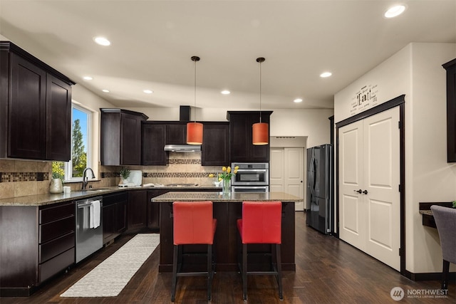 18629 44th Ave W, Lynnwood, WA 98037 - kitchen featuring freestanding refrigerator, dishwasher, a kitchen island, a sink, and under cabinet range hood