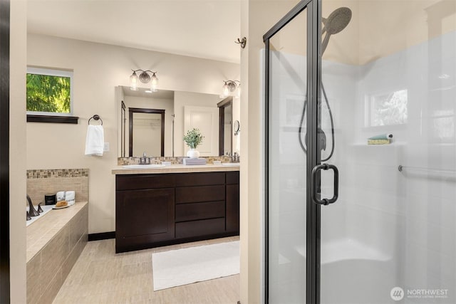 18629 44th Ave W, Lynnwood, WA 98037 - bathroom featuring a shower stall, double vanity, a bath, and tile patterned floors
