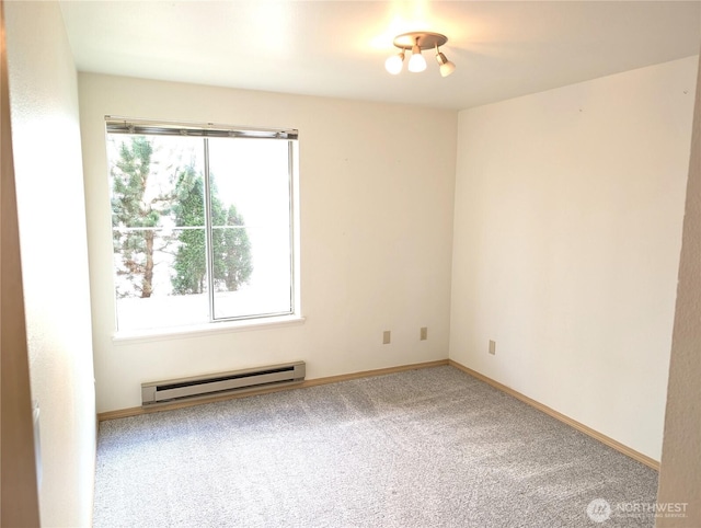 6960 California Ave SW Unit A104, Seattle, WA 98136 - spare room with a baseboard radiator and carpet floors