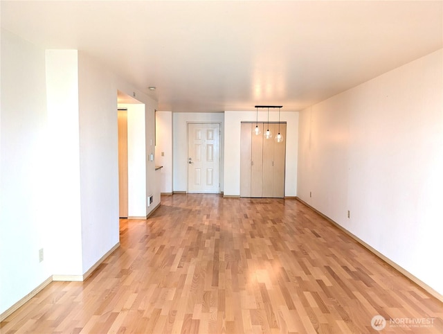 6960 California Ave SW Unit A104, Seattle, WA 98136 - unfurnished room featuring light wood-style flooring and baseboards