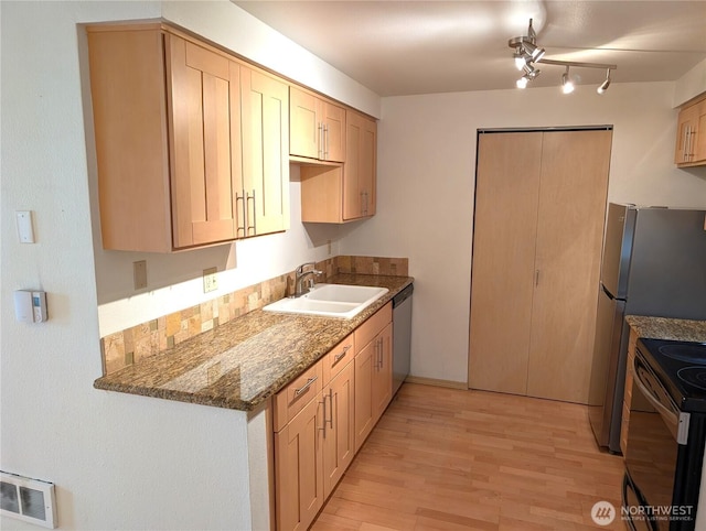 6960 California Ave SW Unit A104, Seattle, WA 98136 - kitchen with electric range, dishwasher, light wood-type flooring, stone countertops, and light brown cabinetry