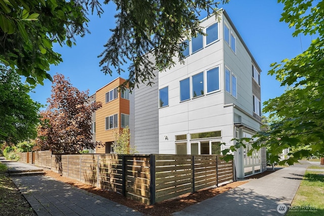 13329 1st Ave NE, Seattle, WA 98125 - view of property exterior featuring a fenced front yard