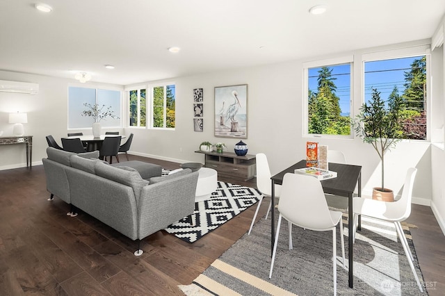 13329 1st Ave NE, Seattle, WA 98125 - living area with dark wood-type flooring, baseboards, an AC wall unit, and recessed lighting
