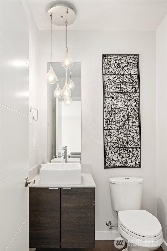 13329 1st Ave NE, Seattle, WA 98125 - half bath with vanity, toilet, and baseboards
