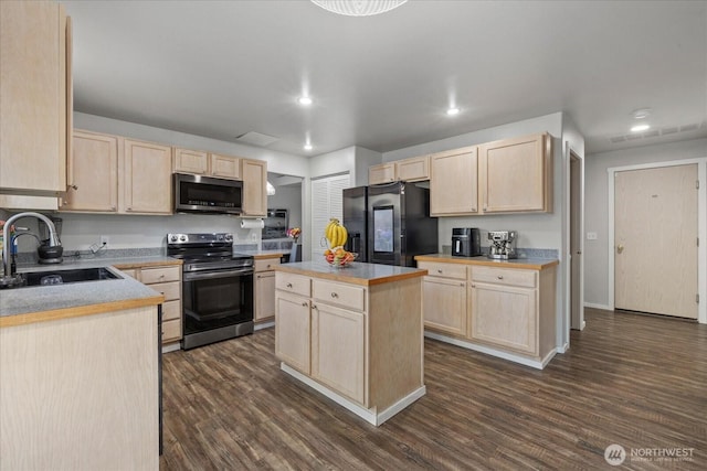 20111 74th Avenue Ct E, Spanaway, WA 98387 - kitchen with light brown cabinets, appliances with stainless steel finishes, a sink, recessed lighting, and dark wood finished floors