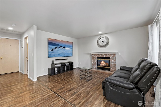 20111 74th Avenue Ct E, Spanaway, WA 98387 - living room with wood finished floors, baseboards, a fireplace, and recessed lighting