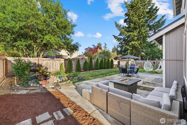 20111 74th Avenue Ct E, Spanaway, WA 98387 - fenced backyard featuring an outdoor living space with a fire pit, a patio, and outdoor dining space
