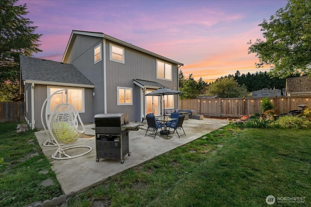 20111 74th Avenue Ct E, Spanaway, WA 98387 - back of property at dusk with a patio area