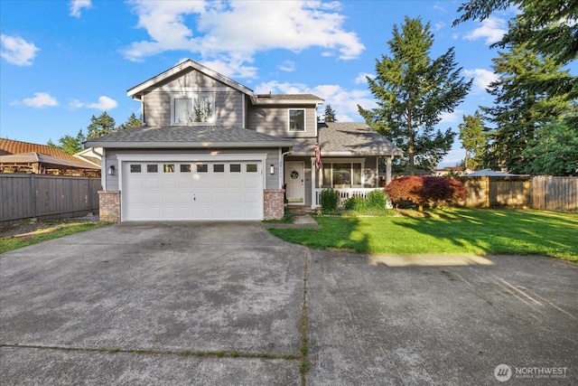 20111 74th Avenue Ct E, Spanaway, WA 98387 - view of front facade featuring driveway, an attached garage, brick siding, and a porch